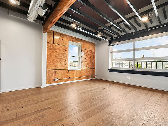 Living rea with working garage door style window.