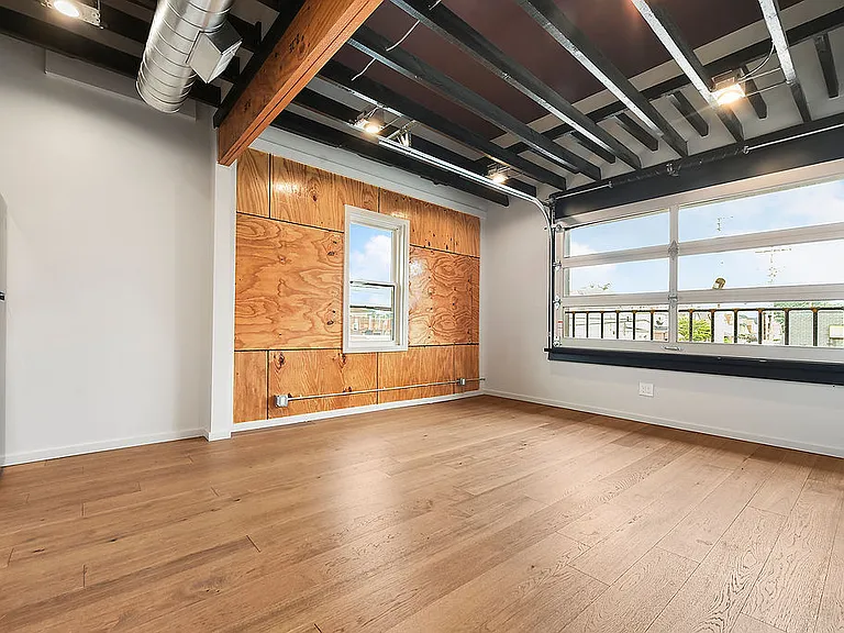 Living rea with working garage door style window.