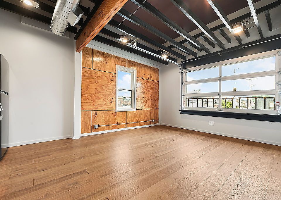 Living rea with working garage door style window.