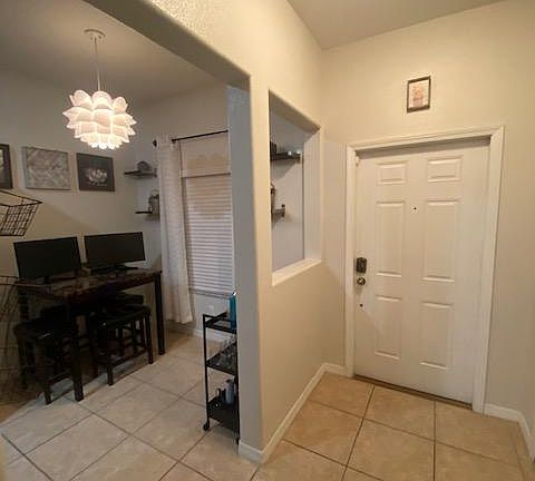 Front entry and view of eat in kitchen
