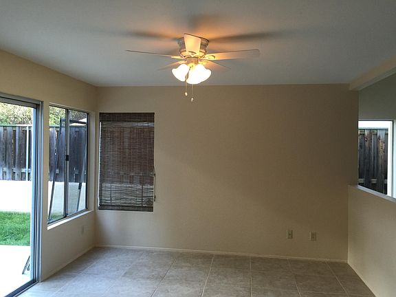 Oversized breakfast area adjacent to kitchen with eat at counter
