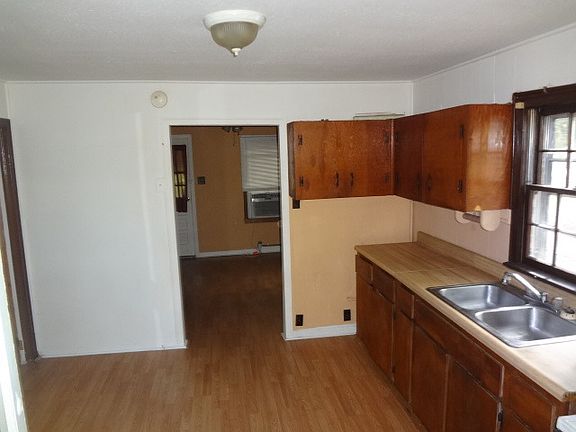View of Kitchen with Living Room Beyond