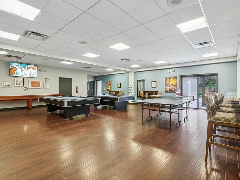 Have fun in the game room with pool and ping pong at University Oaks Apartments near KSU.