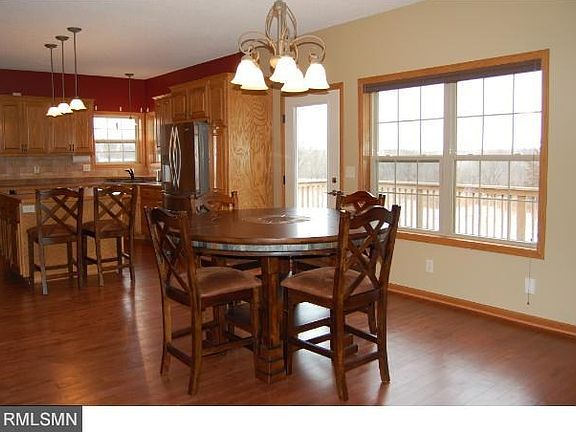 Dining room with a built in buffet and lighted cabinet.