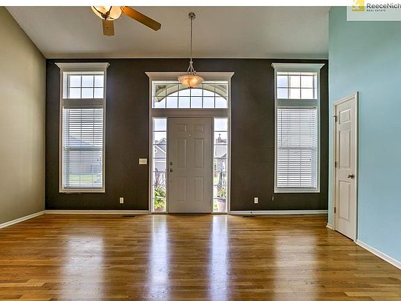 Living Room with lots of natural light! Beautiful wood floors!