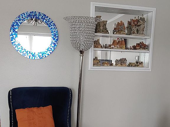 Built in curio shelving adds charm to the living room.