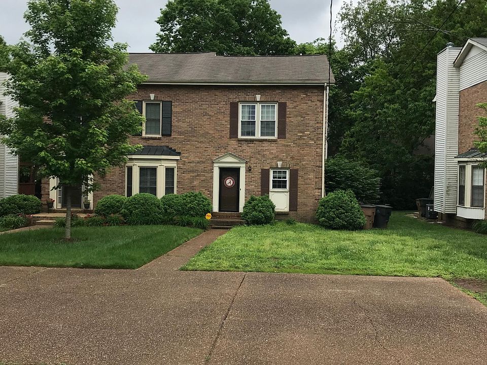 Front view with designated parking area