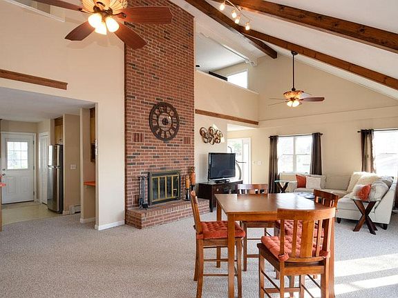 Open concept kitchen, dining room, living room overlook lake