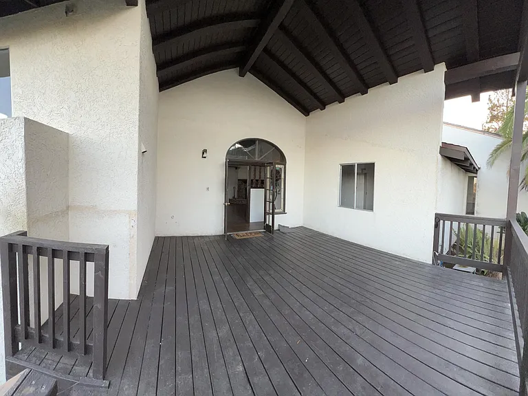 18 x 23' outdoor living deck with high pitched open ceiling and roof