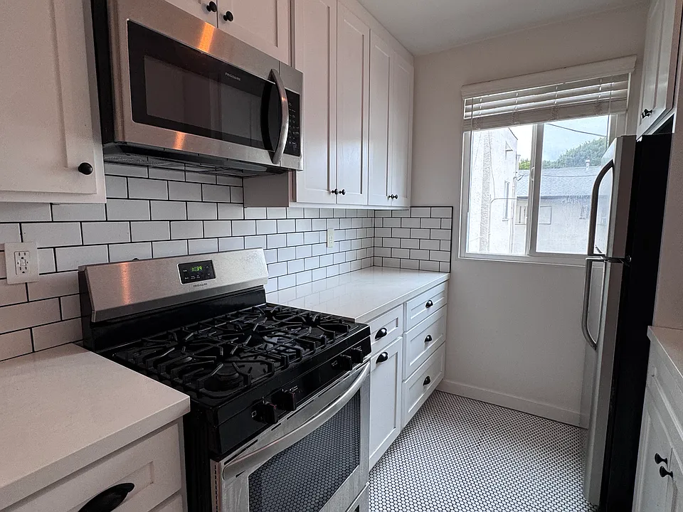 Kitchen with stainless steel appliances.