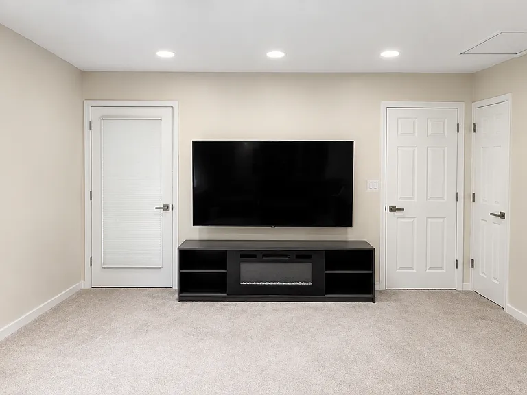 Family room with 75 inch screen
