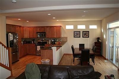 Stunning kitchen with eating space, granite countertops, hardwood floors, stainless steel appliances