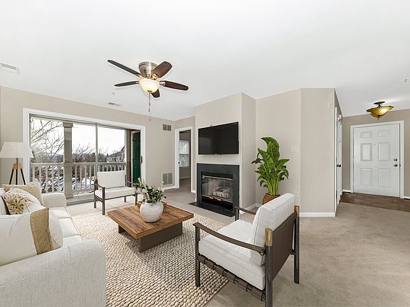Living room w/ staged furniture layout.