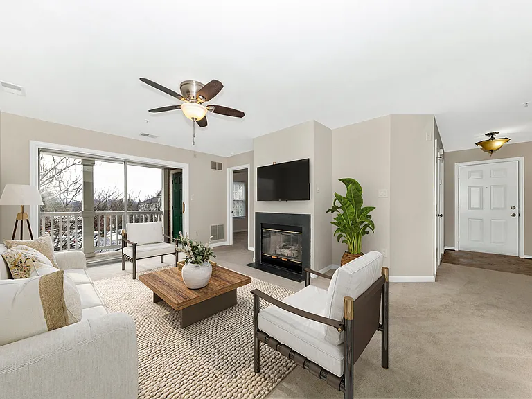 Living room w/ staged furniture layout.