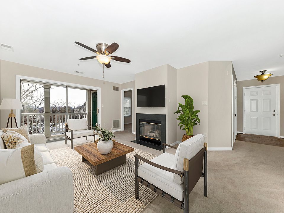 Living room w/ staged furniture layout.