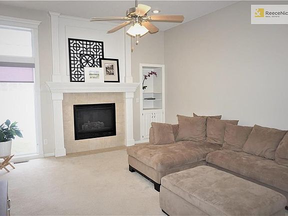 Detail at mantle and built-in shelving and storage.