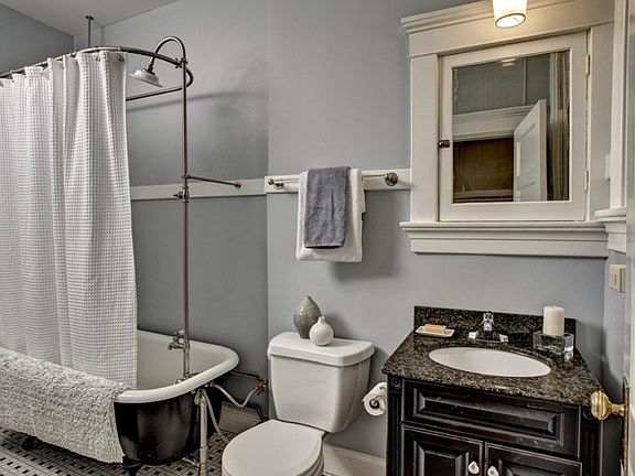 Clawfoot bath and mid century tile
