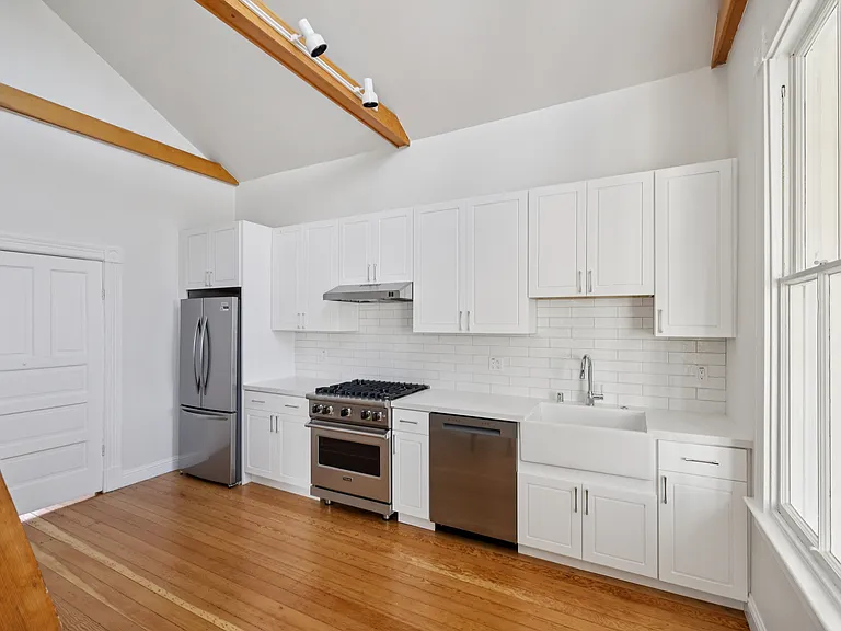 Newly remodeled kitchen with Viking range and vaulted ceilings.