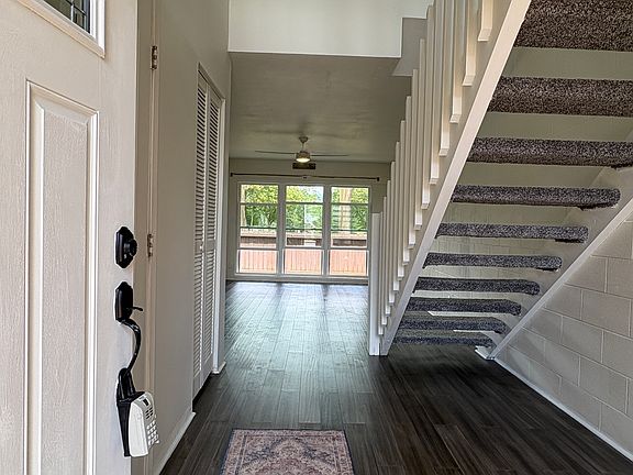 Entryway to home has space on right side for shelving or a dropzone or shoe/coat rack.