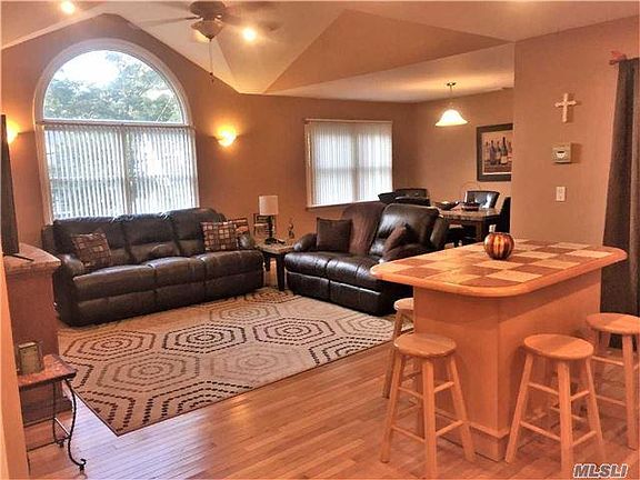 fam rm & dining rm from eat-in-kitchen (hardwood floors throughout)