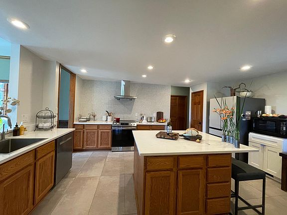 Updated Kitchen with new appliances, countertops and flooring. 
(Except the microwave - it's an oldie but a goodie that we couldn't bear to part with).