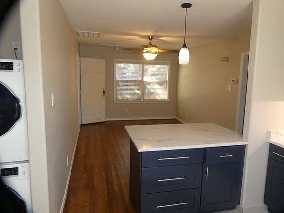 kitchen to living room view; countertop has 10" bar overhang