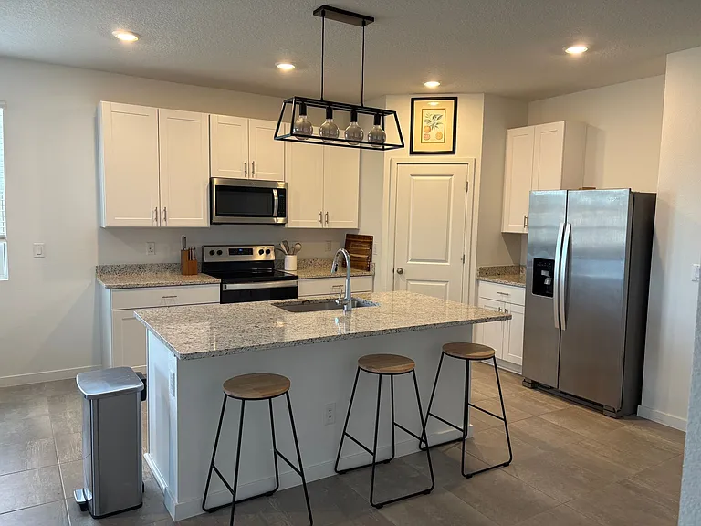 Kitchen with appliances included.
