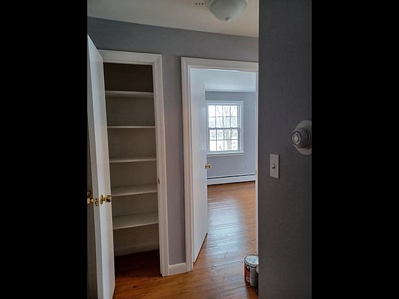 Hallway linen closet looking into bedroom #2
