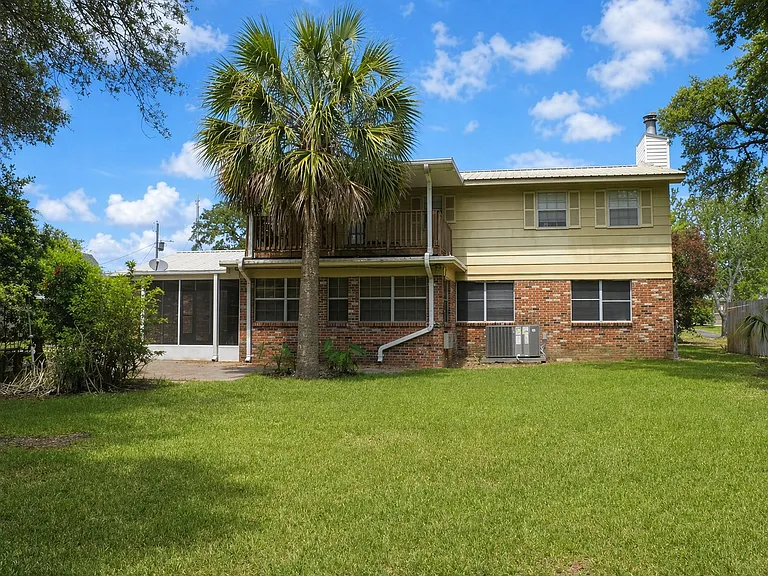 Large Back Yard with Upper covered deck.