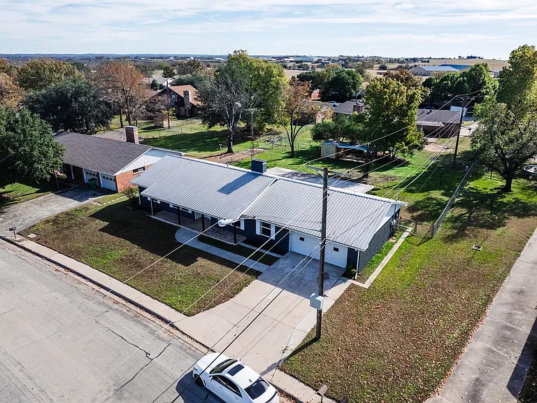 Bird's eye aerial view of the property and surrounding neighborhood