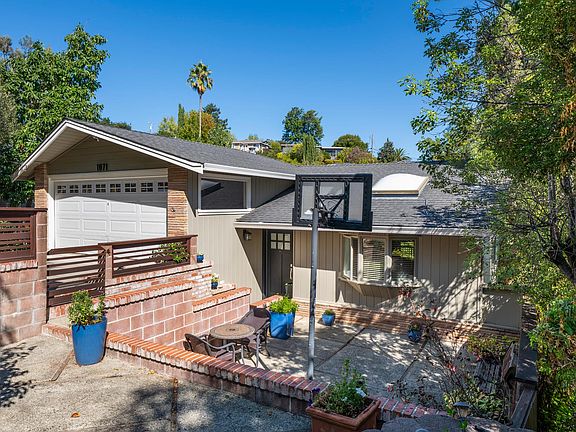 Front of house with private sunken front yard.