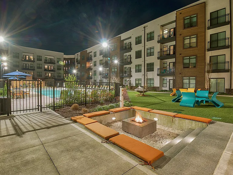 Landscaped courtyard with sunken firepit