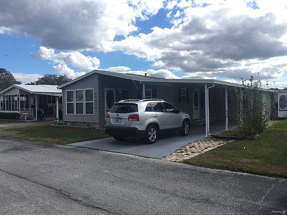 Front of Home w/ Attached Carport