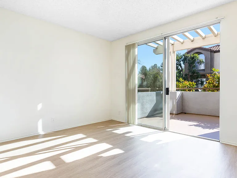 Bedroom with Balcony and Hard Surface Flooring