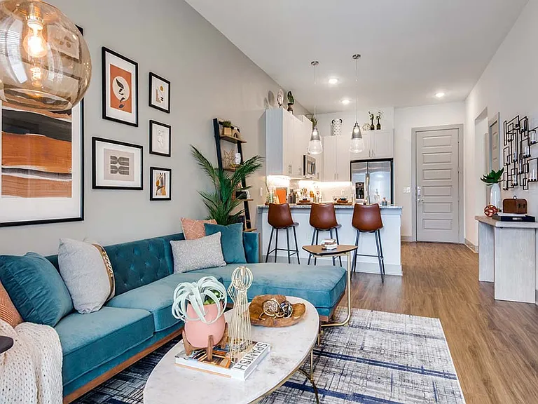 Griffis Frisco apartment living room with wood style floor.