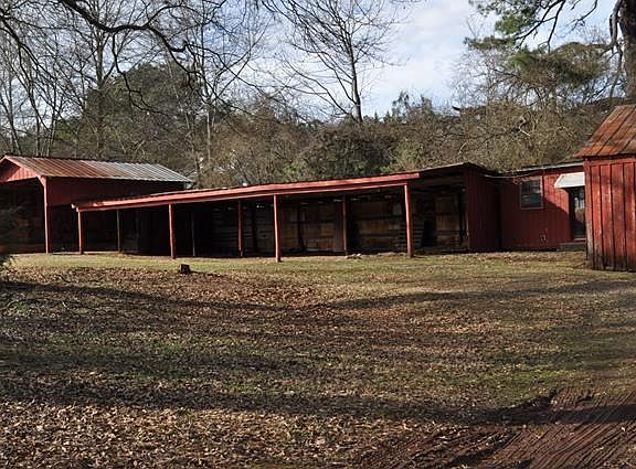 Extended open shed, with one end elevated roof perfect for b