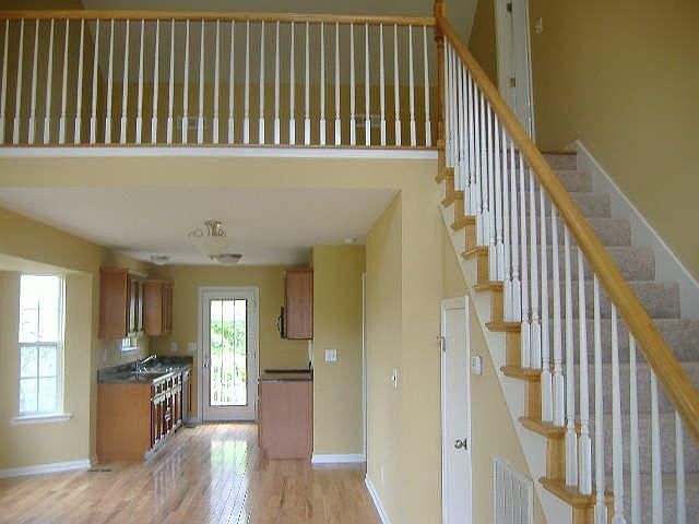 Kitchen and Dining Area with loft overlooking living room
