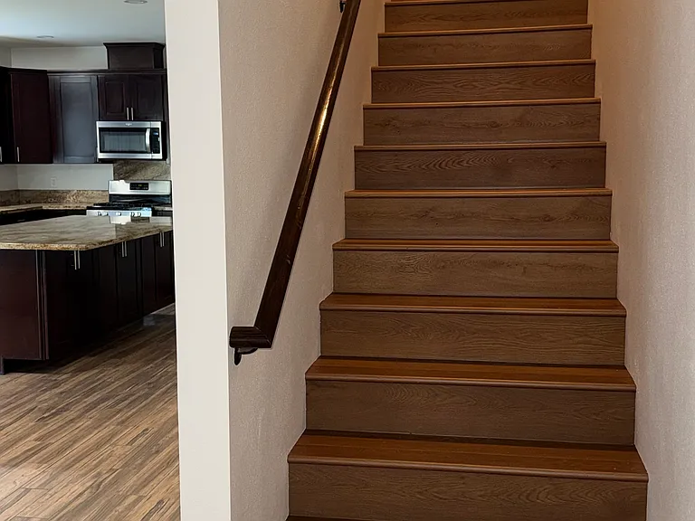 Stairs with laminate wood flooring