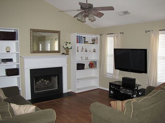 Open living area with fireplace (gas capable) and built-in bookcases