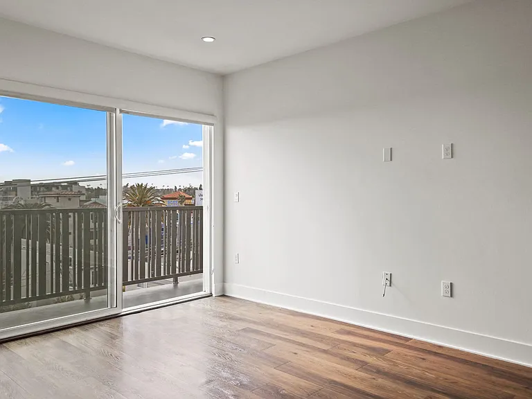 Living Room with a Balcony and City Views
