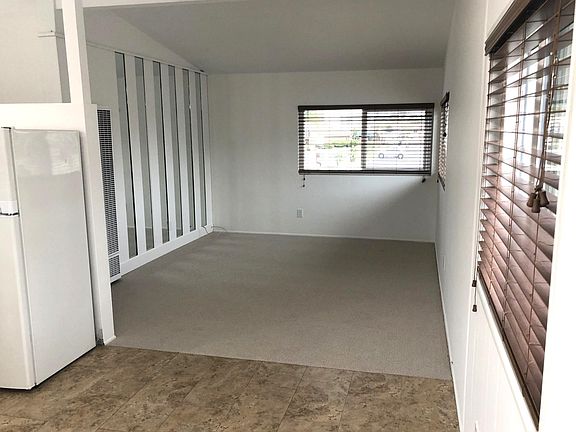 Tile flooring in dining area, new carpet in living room