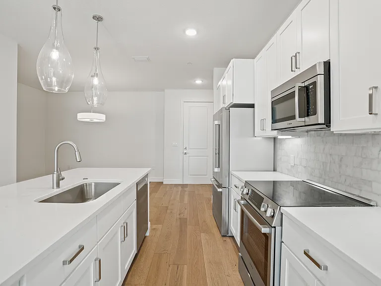 A beautifully appointed kitchen showcasing quality finishes, thoughtful updates, and a clean, modern aesthetic that elevates everyday living.