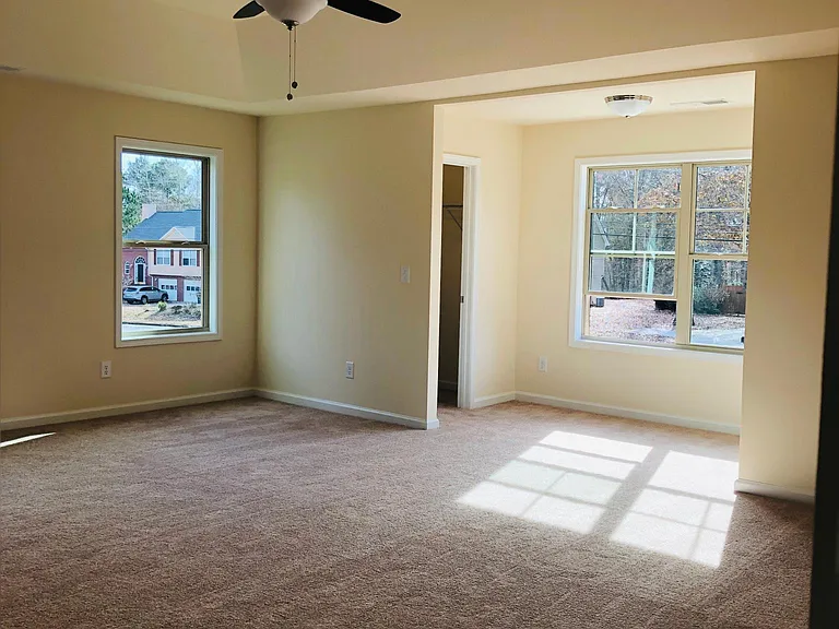 Master bedroom with four walk-in closets
