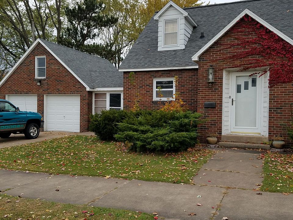 Front with two car garage and enclosed breezeway pictured.