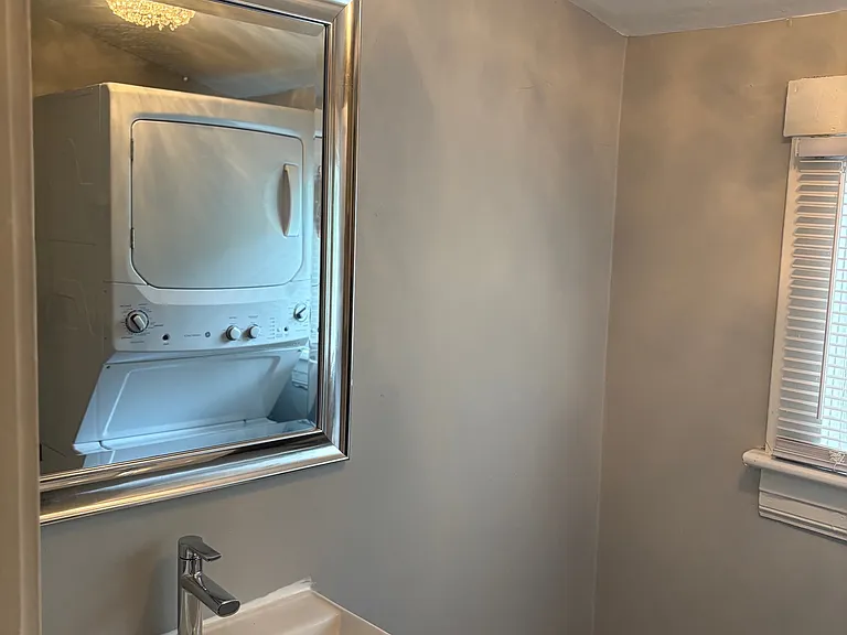 Completely Renovated Half Bath! New Luxury Vinyl Tile, New Vanity, Mirror, Crystal Lighting Fixture, Floating Shelves and NEW Stackable Washer/Dryer!