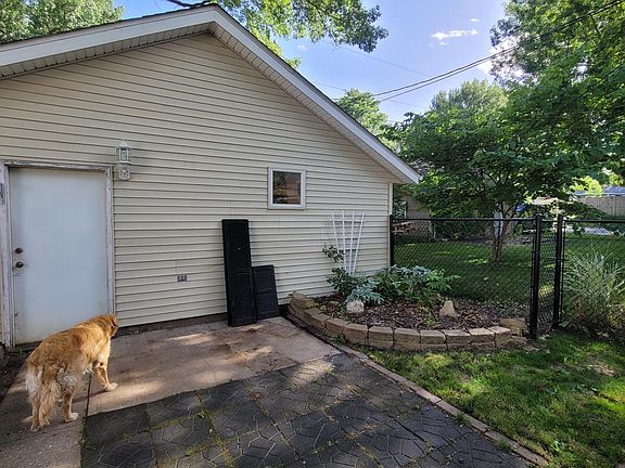 South side patio area and entrance to garage