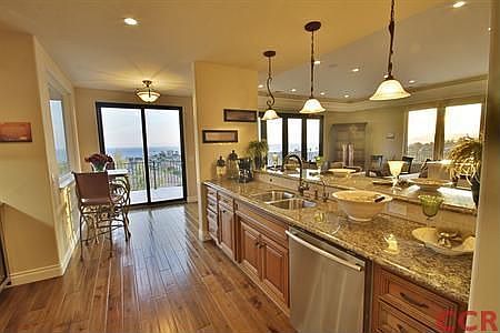 Gourmet kitchen with Sub-Zero Refrigerator, Wolf Appliances and built-in wine cooler.