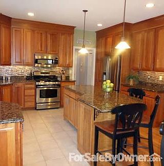 Kitchen
						:
						9 foot ceilings, pendant and under cabinet lighting. Backsplash.