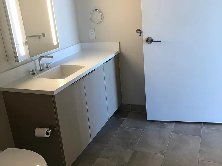Custom pull out storage drawers in the bathroom too