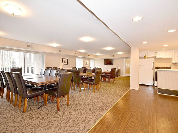 Main floor party room with kitchen and powder room.
